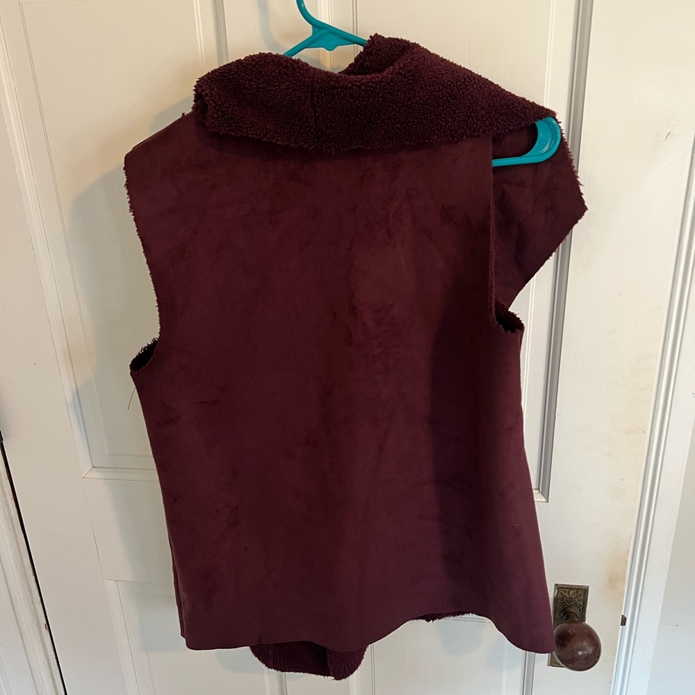 Women’s Sherpa lined, faux suede vest in eggplant purple.